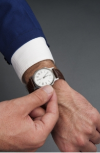 person in a rush checking watch